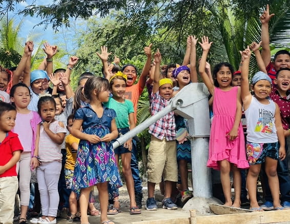 Photo of a childrens raising their hands